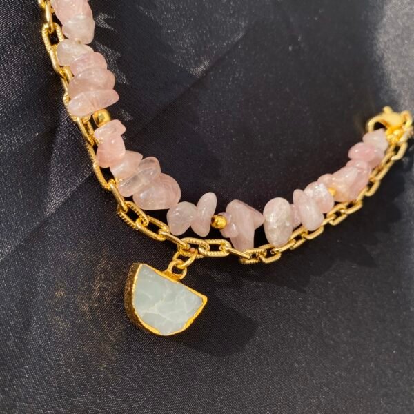 Elegant Rose Glow Bracelet with pink stones and gold chain, perfect for stylish accessories.