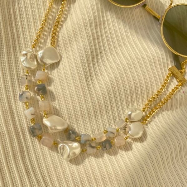 Elegant Moonmist Choker with pearls and gold chains for stylish accessories.