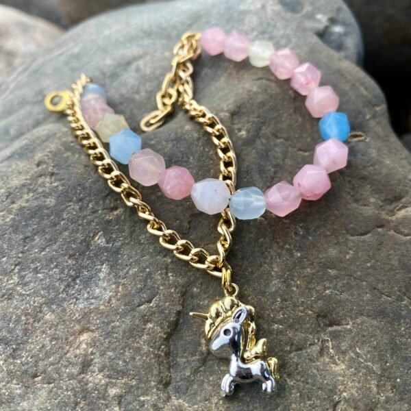 Unicorn charm bracelet featuring pastel-colored beads and gold chain, perfect for kids and unicorn l.
